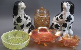 STAFFORDSHIRE SEATED SPANIELS, A PAIR - with colourful Carnival and other glassware