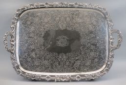 AN IMPRESSIVE LARGE ELECTROPLATED TWIN-HANDLED TRAY - having a floral and scrolled border with