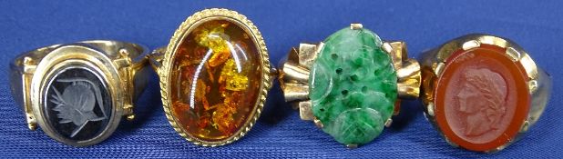 9CT GOLD DRESS RINGS (4) - one with large oval amber cabochon, one of green jade and two seals,