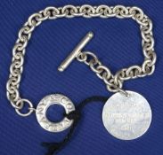 TIFFANY & CO SILVER BRACELET with 'Please return to Tiffany & Co New York tag' and open roundel