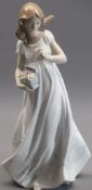 LLADRO - model 6921, 'Treasures of the earth', a young girl collecting flowers, 32cms tall