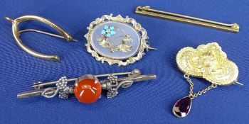 9CT GOLD WISHBONE, 1grm, an 18ct gold narrow pin, 2grms, a small shaped floral brooch, 2.4grms and