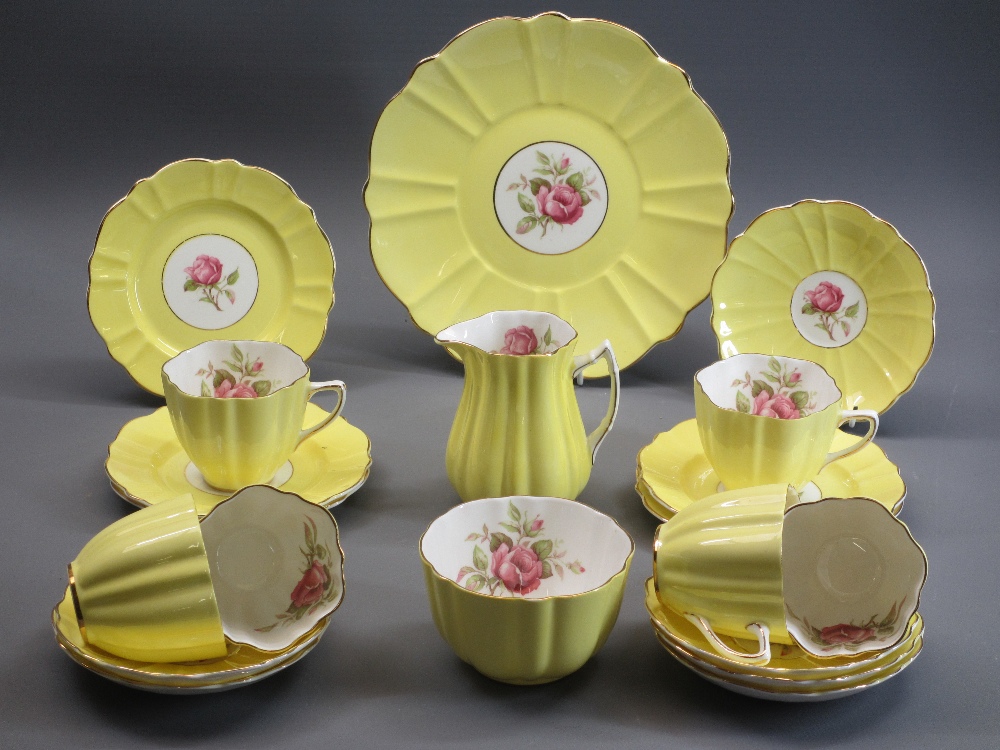 OLD ROYAL BONE CHINA PART TEA SERVICE - in yellow and gilt with interior rose decoration, 20 pieces