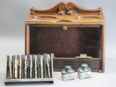 FOUNTAIN PENS contained in a vintage style cigar humidor/display, eight various marbled effect