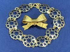 9CT GOLD LINK BRACELET, 4.4grms, and a 9ct gold bow pin brooch with bright cut decoration, 2.