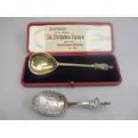 GILT SILVER CASED SPOON with card entitled 'Reproduction of the Celebrated St Nicholas spoon sold in