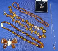 MODERN AMBER JEWELLERY, 6 ITEMS - to include five various necklaces, two having sterling silver