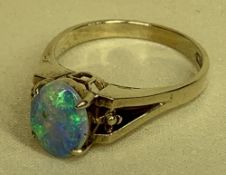 18CT GOLD OPAL DRESS RING having an oval cabochon opal for approximately 9 x 7mms, visual