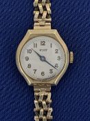 TISSOT LADY'S 9CT GOLD BRACELET WRISTWATCH - the dial set with Arabic numerals, 16.5grms gross