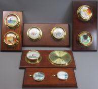 BRASS MOUNTED CHINA COLLECTABLES ON MAHOGANY WALL BOARDS (5)