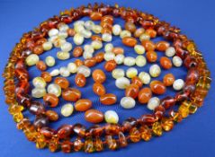 DARK AMBER NECKLACE, untested, 68cms L and a gold and amber necklace of irregular stones,