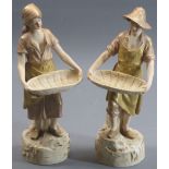 ROYAL DUX (2) - stamped 2456 and 2457 - young couple each with basket, 27cms tall