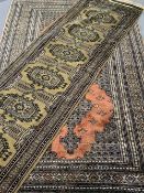 EASTERN SILK TYPE RUGS (2) to include a black and red ground rug with repeating diamond central