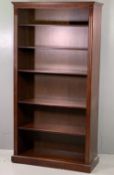 REPRODUCTION MAHOGANY OPEN BOOKCASE with dentil moulded cornice and interior adjustable shelving, on