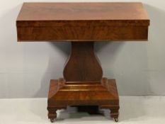 REGENCY MAHOGANY FOLDOVER TEA TABLE with interior storage compartment, on a shaped column and a