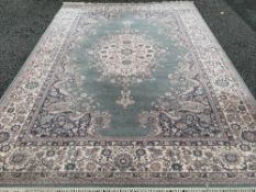 LARGE EASTERN STYLE WOOLLEN CARPET with tasselled ends, Super Keshan, green grey ground with wide