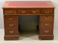 EDWARDIAN MAHOGANY TWIN PEDESTAL DESK with gilt tooled red leather inset over three frieze drawers