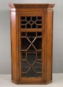 CIRCA 1900 MAHOGANY WALL HANGING CORNER CABINET having a dentil moulded cornice over a single