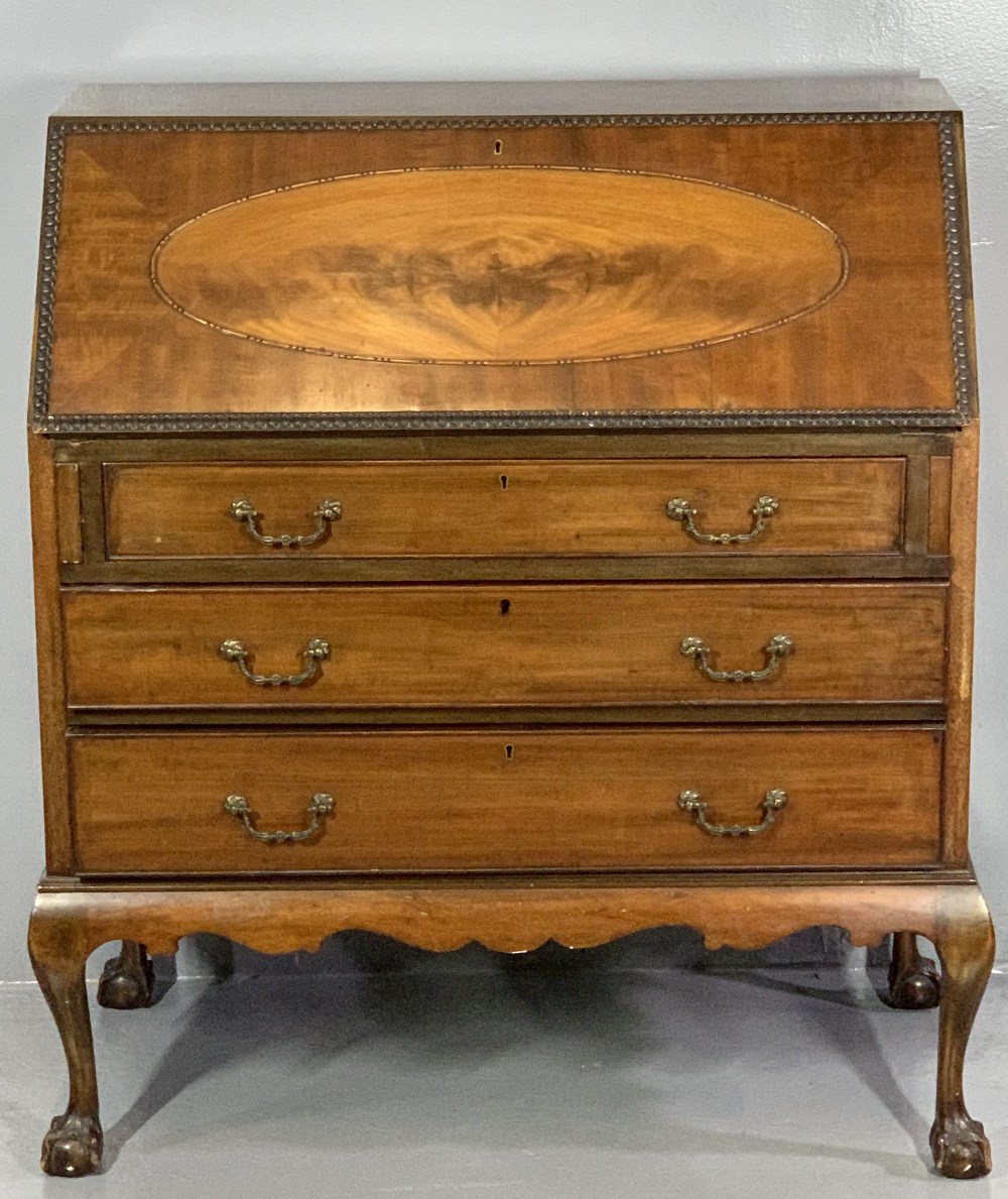 VINTAGE MAHOGANY FALL FRONT BUREAU with beaded oval panel to the fall and moulded edging, Greek