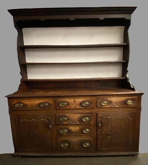 CIRCA 1760 CONWY VALLEY OAK DRESSER having a pot belly shape three shelf rack with wide back boards,