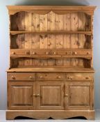 REPRODUCTION PINE DRESSER - the shaped rack with two upper shelves and four lower drawers over a