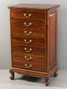 REPRODUCTION HARDWOOD FOUR DRAWER CHEST with brass pommels and swan neck handles having carved