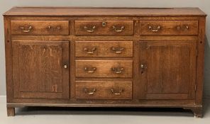 ANTIQUE OAK NORTH WALES DRESSER BASE with a possibly non-associated rack, the single plank top