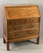 VINTAGE MAHOGANY FALL FRONT BUREAU having two short and two long drawers under a sloped fall, on