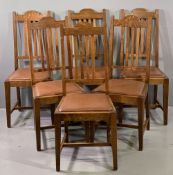 SIX OAK DINING CHAIRS having dome tops and four bar splatbacks with rexine pad seats, 103cms H,