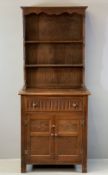 NEATLY PROPORTIONED PRIORY STYLE OAK DRESSER, the two shelf rack with shaped cornice over a base