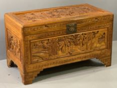 JAPANESE DEEP CARVED CAMPHOR WOOD LIDDED CHEST with interior latticed lift-out tray, 59cms H, 101cms