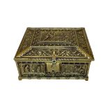 An ornate Victorian plush lined gilt brass casket