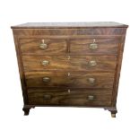 A Georgian mahogany bedroom chest of two short over three long graduated drawers with inlaid detail