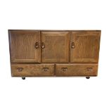 1970's Ercol Elm Sideboard, double cupboard and single cupboard with cutlery drawer, over two drawer