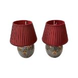A pair of 20th century Chinese table lamps with autumn floral relief