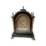 A late 19th/early 20th century ebonised and cast brass mounted mantle clock.
