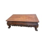 A 19th century Chinese carved hardwood low opium table