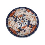 A large Japanese Imari charger, with floral decoration
