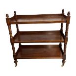 A Victorian mahogany three tier buffet, with baluster turned supports