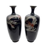 A pair of Meiji Period Cloisonne vases depicting dragons in a black background.