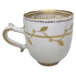 An English 18th century gold and black gilded cup / An English 18th century blue and white pearlware