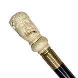 A carved Ivory figural handled walking stick,