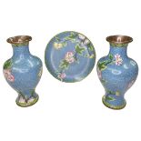 Two Oriental light blue flower enamelled cloisonne vases