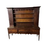 18th century and later Welsh oak dresser, the top with 3 central shelves