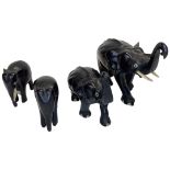 A mixed lot comprising 4 carved Ebony and Bone Elephants