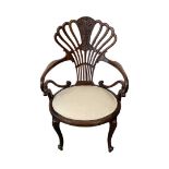 Peacock back mahogany armchair