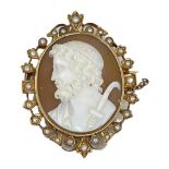 An Antique Shell Cameo Brooch, Mounted in a Scrolled Gold and Split Pearl Frame, circa 1870.