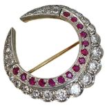 A Diamond and Ruby Double Crescent Brooch, circa 1950.