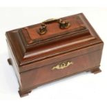 A Georgian mahogany tea caddy with pewter canisters