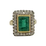 An Attractive Emerald and Diamond Cluster Ring.